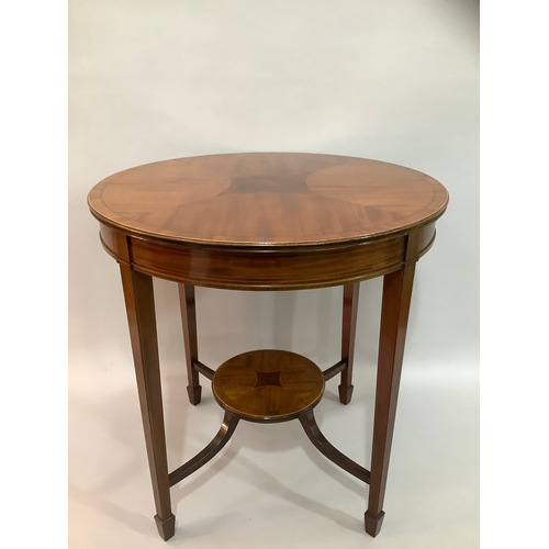 452 - An Edward VII mahogany cross banded occasional table of circular outline,  on four tapered legs join... 