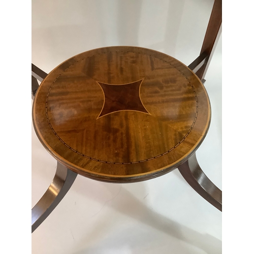 452 - An Edward VII mahogany cross banded occasional table of circular outline,  on four tapered legs join... 