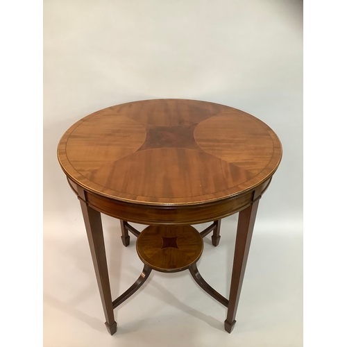 452 - An Edward VII mahogany cross banded occasional table of circular outline,  on four tapered legs join... 