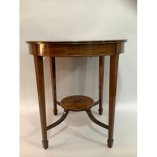 452 - An Edward VII mahogany cross banded occasional table of circular outline,  on four tapered legs join... 