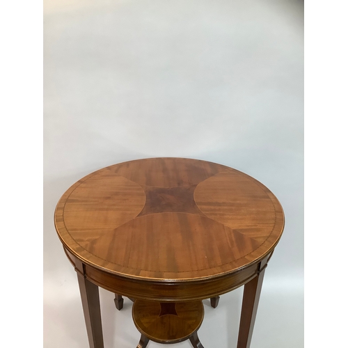 452 - An Edward VII mahogany cross banded occasional table of circular outline,  on four tapered legs join... 