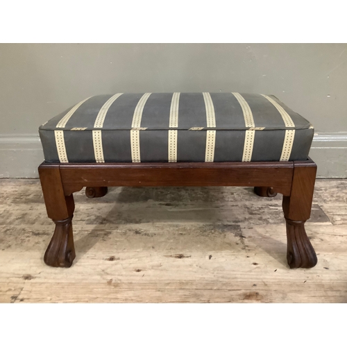 454 - A walnut Pratts of Bradford foot stool on carved feet with striped upholstery, 60cm wide