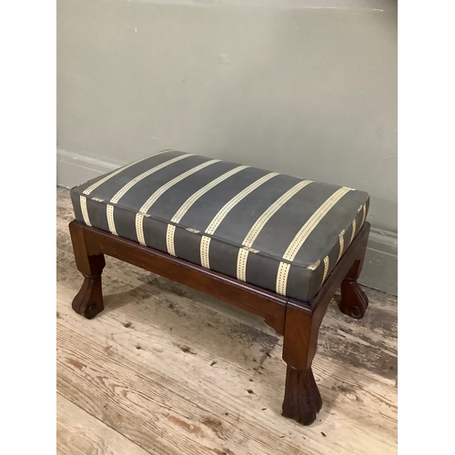 454 - A walnut Pratts of Bradford foot stool on carved feet with striped upholstery, 60cm wide