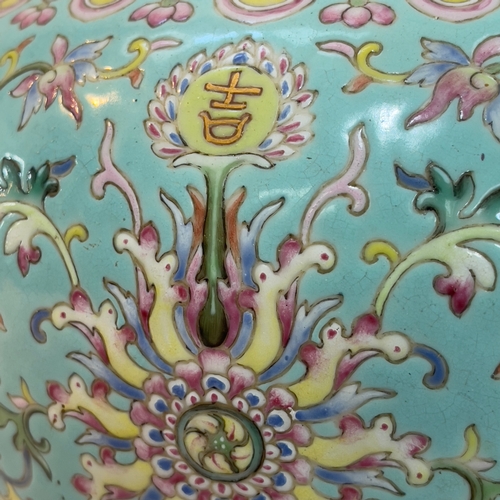 73 - A Chinese jardinière, the turquoise ground enamelled in famille rose, yellow, green and blue with lo... 