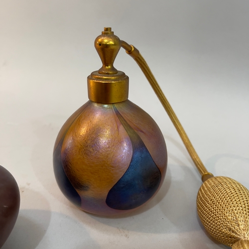 76 - A John Ditchfield Glasform iridescent glass perfume atomiser, incised signature and paper label to b... 