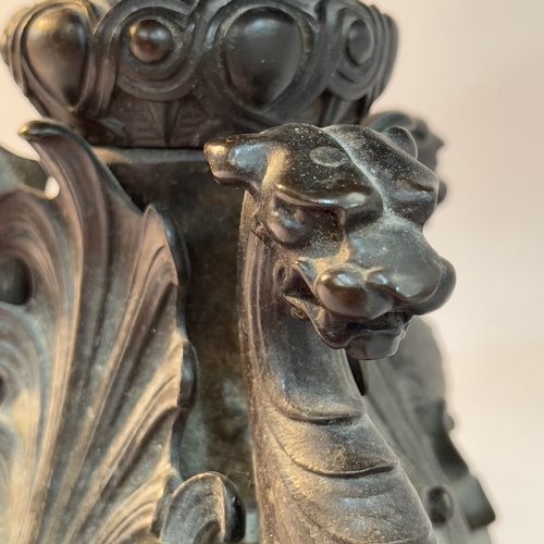 81 - A 19th century bronze tazza/stand the dished top on four lion mask legs with paw feet surmounted by ... 