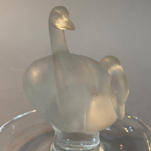 87 - A glass Lalique trinket dish with two swans, signed Lalique France to base, 9cm