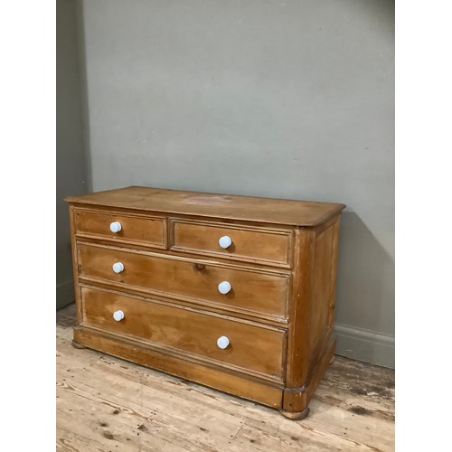 148 - A stained pine chest of two short above two long drawers on plinth base, 117cm