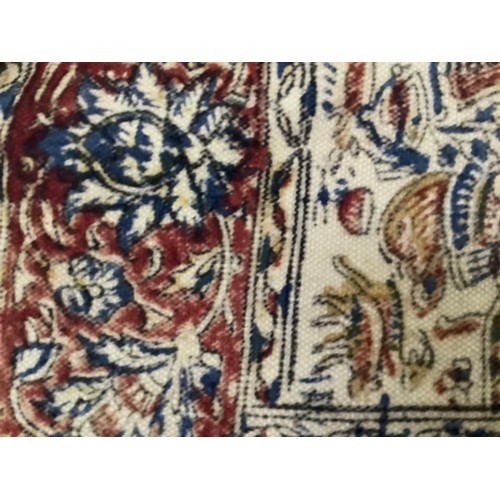 458 - An Iranian Kalamkari style printed textile the central field printed with figures and animals within... 