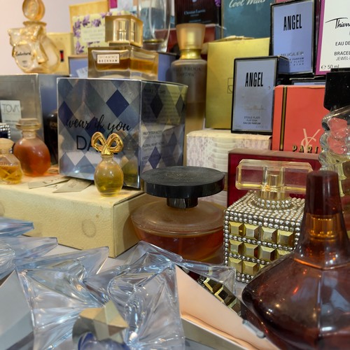 114 - A quantity of vintage and modern perfume bottles including a sealed Hermes Caleche, YSL Paris, Fendi... 