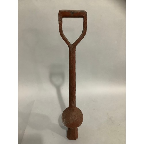 137 - A bell clapper, 60cm high