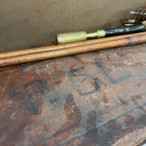 109 - A leather fitted gun case, containing brass tipped ramrod and another canvas bound case by the Linds... 