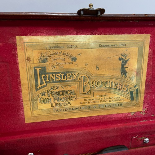 109 - A leather fitted gun case, containing brass tipped ramrod and another canvas bound case by the Linds... 