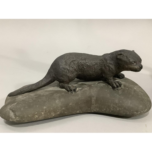 12 - A bronze effect hare by Frith Sculpture, 29cm, together with a model of an otter upon a rock, 17.5cm... 