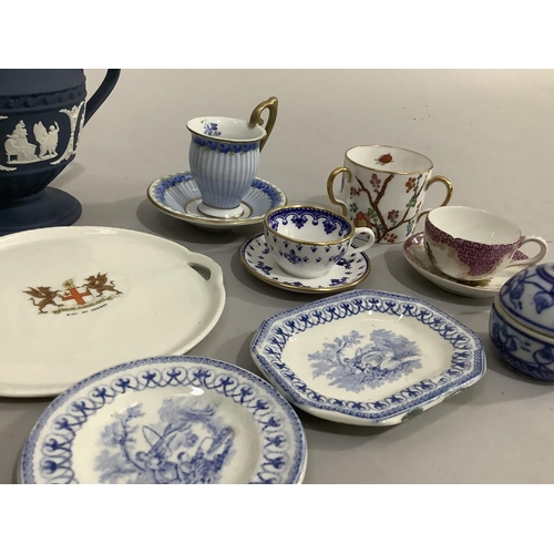 125 - A collection of cabinet and miniature cups and saucers, blue and white dolls tea ware, Wedgwood Jasp... 