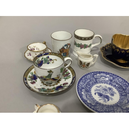 125 - A collection of cabinet and miniature cups and saucers, blue and white dolls tea ware, Wedgwood Jasp... 