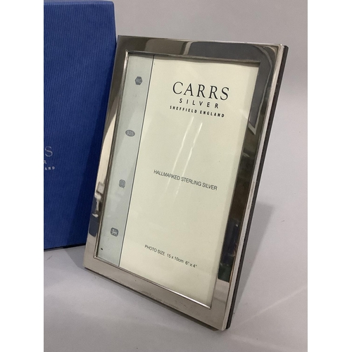 173 - A modern sterling silver photograph frame of plain design by Carrs of SHeffield, boxed, as new, 17cm... 