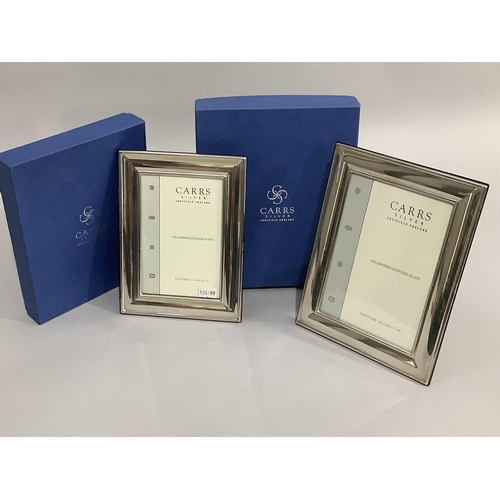 175 - A pair of modern sterling silver photograph frames of graduated size, boxed, as new, 20cm x 15cm and... 