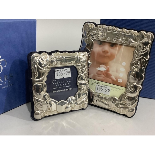 174 - A pair of modern sterling silver photograph frames of graduated size, embossed with teddy bear and o... 