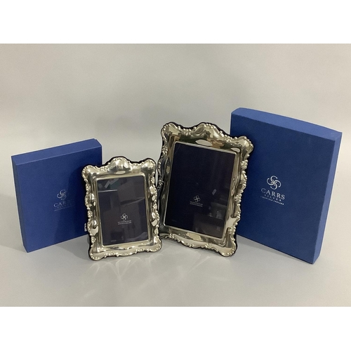 178 - A pair of modern sterling silver photograph frames of graduated size, boxed, as new, 26.5cm x 19.5cm... 