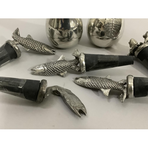 136 - A set of five pewter fish mounted bottle stoppers and another with two frog finial, a polished pewte... 