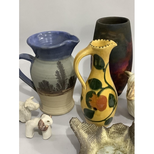 134 - A collection of Studio pottery including painted jug by K Waller, another by Earthworks pottery of S... 