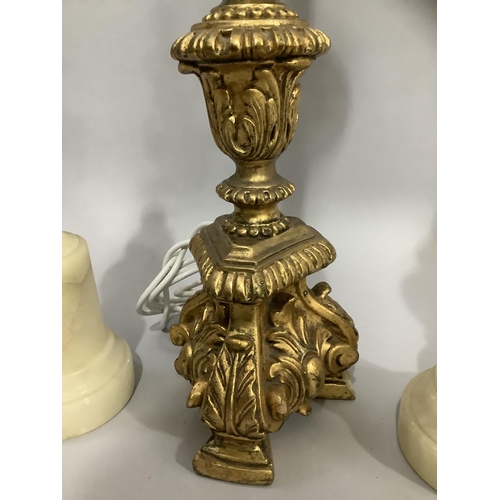 144 - A gilt baroque style table lamp, 57cm high to fitting, together with a pair of alabaster table lamps... 