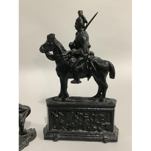 59 - Two cast iron doorstops in the form of Punch and  the other in the form of a cavalry officer on a  p... 