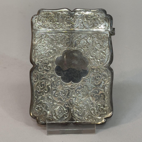 200 - A Victorian silver card case, Birmingham 1894, Colen Hewer, Cheshire, foliate scroll engraved with v... 