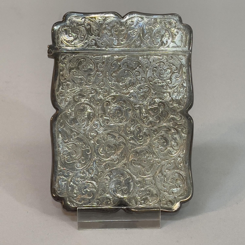 200 - A Victorian silver card case, Birmingham 1894, Colen Hewer, Cheshire, foliate scroll engraved with v... 