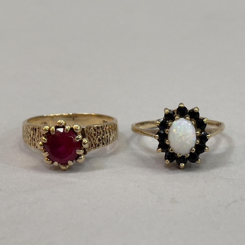 221 - Two dress rings both in 9ct. gold, variously claw set with synthetic ruby, sapphire and opal, total ... 