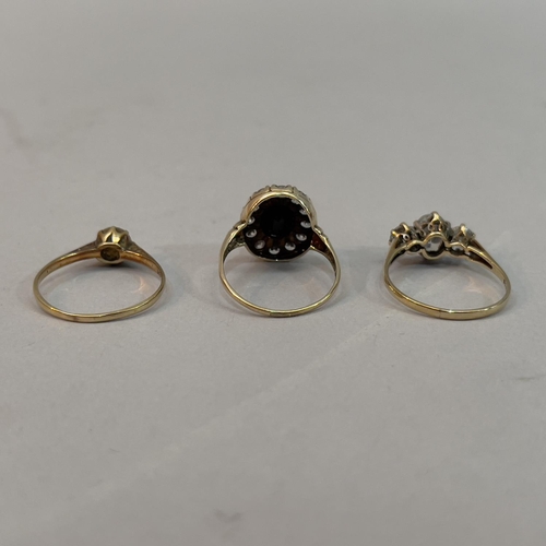 212 - Three dress rings all in 9ct gold, variously set in cubic zirconia and sapphire,
total approximate w... 