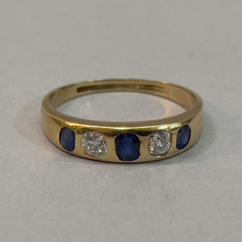 220 - A Victorian Sapphire and diamond five stone ring in 18ct. gold, the graduated oval facetted sapphire... 