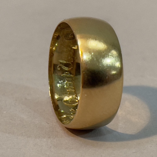 215 - A Victorian 18ct. gold wedding ring, engraved to the inside “God Abide, Grant Us Thy Love” in Gothic... 