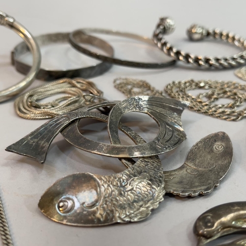 203 - A collection of silver and white metal jewellery (this metal tests as silver) including bangles, nec... 