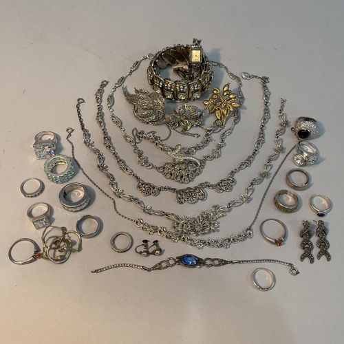 194 - A collection of jewellery in white metal (tests as silver) including rings variously set with amethy... 