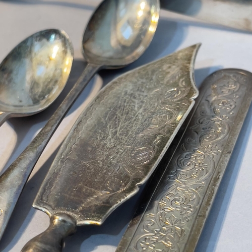 168 - A collection of 19th and early 20th century silver spoons, pickle fork, sugar tongs etc