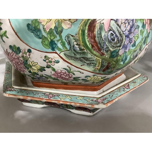 145 - A modern Chinese pottery jardiniere enamelled with exotic bird and peony within a reserve against a ... 