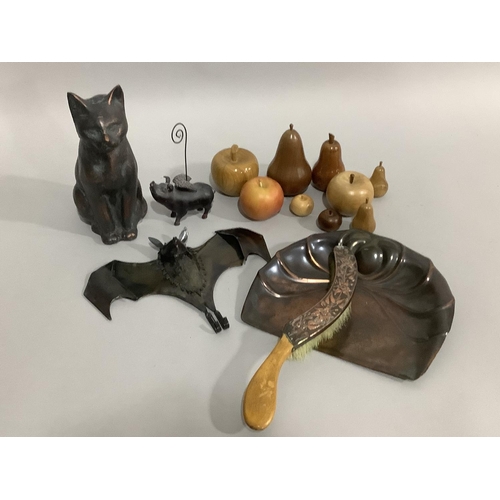 106 - A garden cat ornament, tin bat coat hook, flying pig, an art nouveau copper crumb scoop and brush an... 