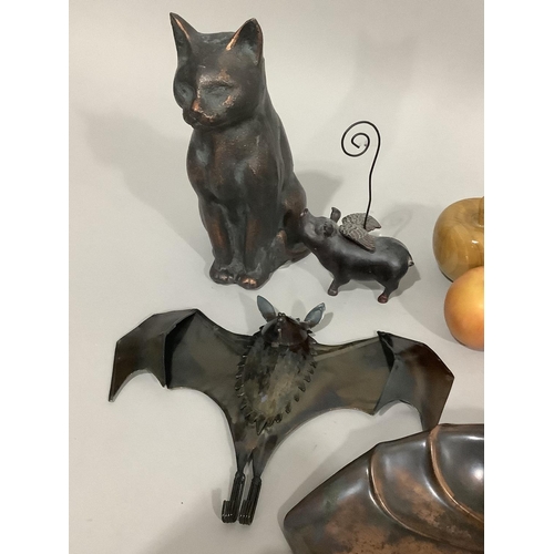 106 - A garden cat ornament, tin bat coat hook, flying pig, an art nouveau copper crumb scoop and brush an... 