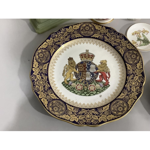 100 - Two Spode Elizabeth II commemorative plates, a Buckingham Palace souvenir mug, a Port Meirion parian... 