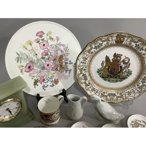 100 - Two Spode Elizabeth II commemorative plates, a Buckingham Palace souvenir mug, a Port Meirion parian... 