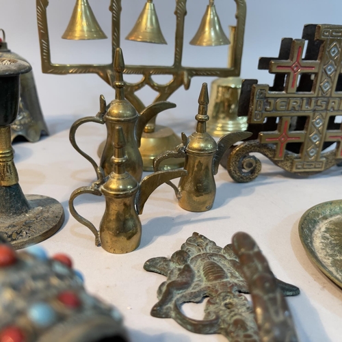 119 - A Chinese bronze Guanshiyin bell, brass meditation bell tree, a Tibetan prayer wheel with cabochons ... 