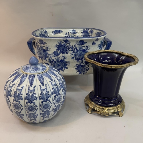 58 - A reproduction blue and white two handled foot bath of floral decoration 20cm high x 45cm wide appro... 