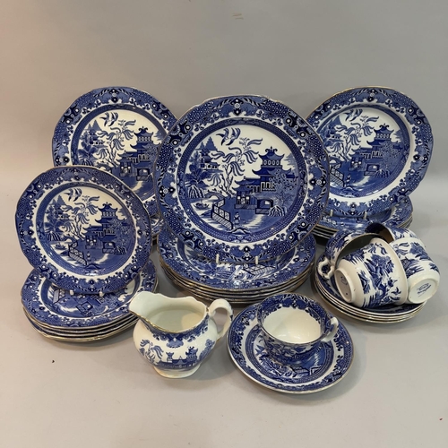 133 - Quantity of Burleigh ware blue and white willow pattern dinner ware with gilt rims, six dinner plate... 