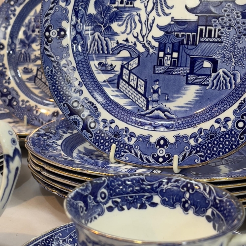 133 - Quantity of Burleigh ware blue and white willow pattern dinner ware with gilt rims, six dinner plate... 