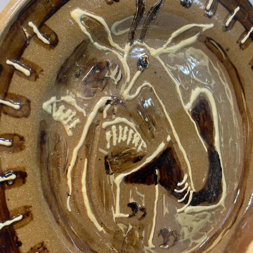 98 - A brown and white glazed earthenware bowl having a leaf design, bearing the name Ian Auld to base, p... 