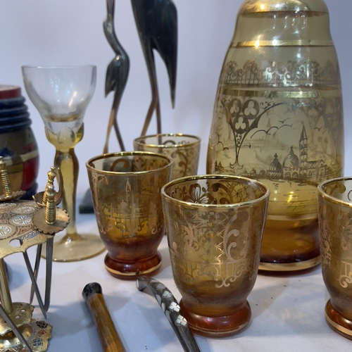 109 - A glass gilt decorated drinking set with decanter and stopper and nine glasses, other glasses, a car... 