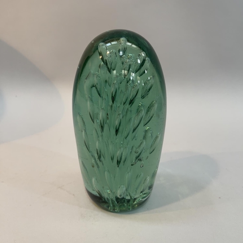 9 - A 19th century green glass dump, internally with radiating tear drops, 17cm