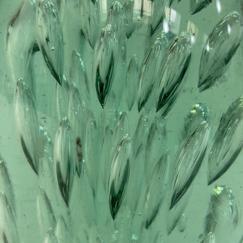 9 - A 19th century green glass dump, internally with radiating tear drops, 17cm